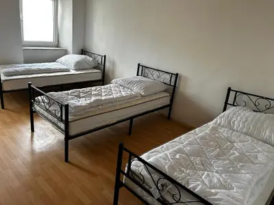 Ein Bett oder Betten in einem Zimmer der Unterkunft Monteur Unterkunft in Helmbrechts