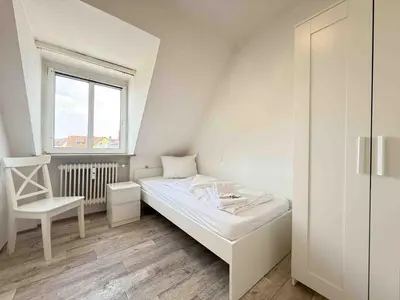 Ein Bett oder Betten in einem Zimmer der Unterkunft SWF123 gemütliche Monteurwohnung