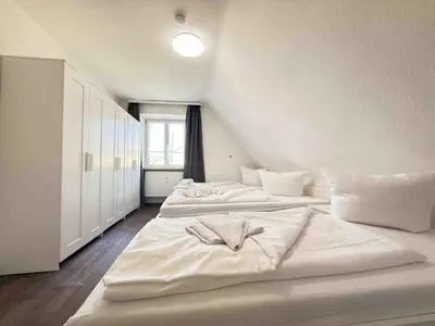 Ein Bett oder Betten in einem Zimmer der Unterkunft SWF123 gemütliche Monteurwohnung