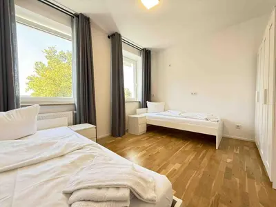 Ein Bett oder Betten in einem Zimmer der Unterkunft AM1237 moderne Monteurwohnung mit Balkon