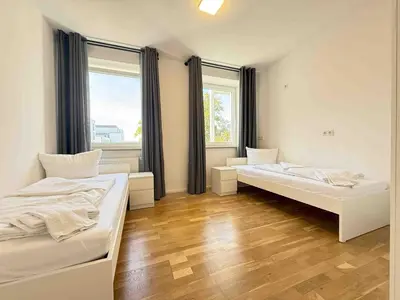 Ein Bett oder Betten in einem Zimmer der Unterkunft AM1237 moderne Monteurwohnung mit Balkon
