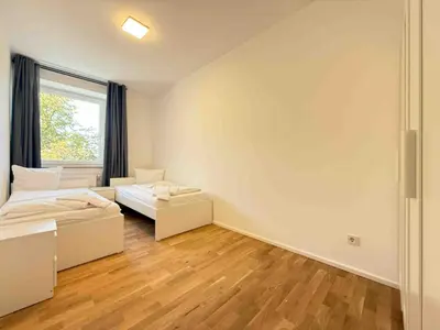Ein Bett oder Betten in einem Zimmer der Unterkunft AM1237 moderne Monteurwohnung mit Balkon