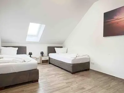 Ein Bett oder Betten in einem Zimmer der Unterkunft STB114 moderne Monteurwohnung