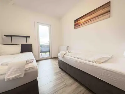 Ein Bett oder Betten in einem Zimmer der Unterkunft STB114 moderne Monteurwohnung