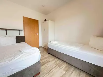 Ein Bett oder Betten in einem Zimmer der Unterkunft STB114 moderne Monteurwohnung