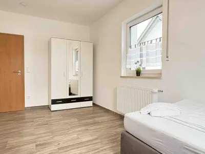 Ein Bett oder Betten in einem Zimmer der Unterkunft STB114 moderne Monteurwohnung