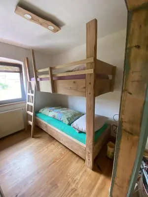 Ein Bett oder Betten in einem Zimmer der Unterkunft Ferienwohnung auf dem Land, Haus Hans Stepha
