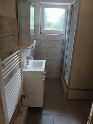 Ein Badezimmer in der Unterkunft 2-Bett Zimmer