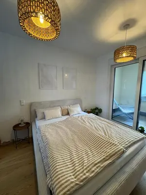 Ein Bett oder Betten in einem Zimmer der Unterkunft Zentrale Citywohnung Bayreuth, Loggia, Garage