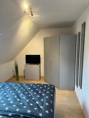 Ein Bett oder Betten in einem Zimmer der Unterkunft Ferienwohnung Kraxner
