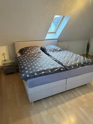 Ein Bett oder Betten in einem Zimmer der Unterkunft Ferienwohnung Kraxner