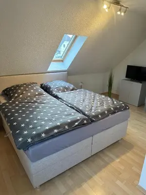 Ein Bett oder Betten in einem Zimmer der Unterkunft Ferienwohnung Kraxner