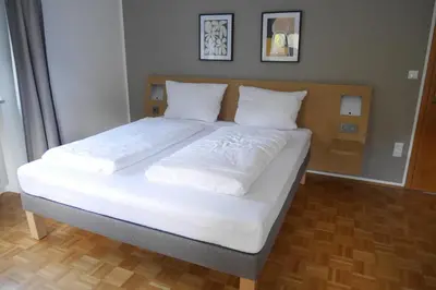 Ein Bett oder Betten in einem Zimmer der Unterkunft Ferienwohnung Naznhaus