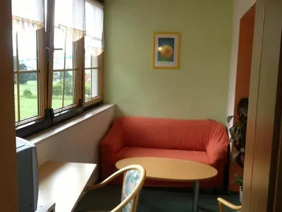 Ein Sitzbereich in der Unterkunft Landhotel Waldesruh