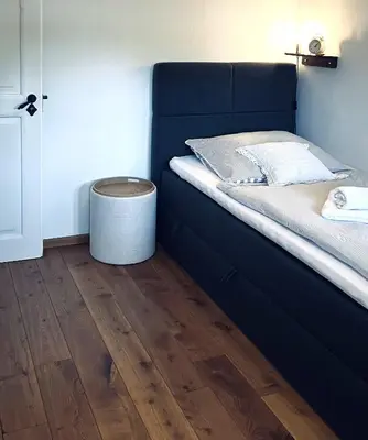 Ein Bett oder Betten in einem Zimmer der Unterkunft Meisterhaus Ferienwohnung Bayreuth