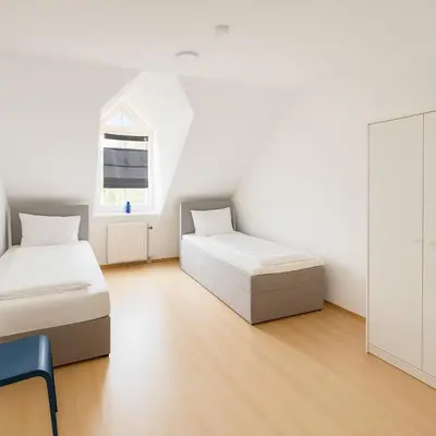 Ein Bett oder Betten in einem Zimmer der Unterkunft SUNNYHOME Monteurwohnungen und Apartments in Schwandorf
