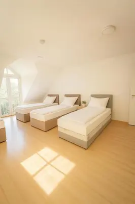 Ein Bett oder Betten in einem Zimmer der Unterkunft SUNNYHOME Monteurwohnungen und Apartments in Schwandorf