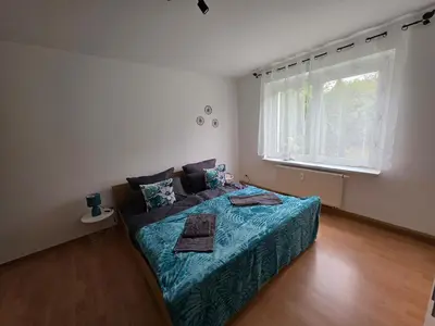 Ein Bett oder Betten in einem Zimmer der Unterkunft Ferienwohnung Wagner