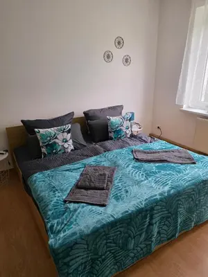Ein Bett oder Betten in einem Zimmer der Unterkunft Ferienwohnung Wagner