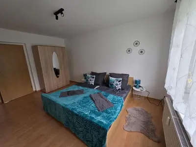 Ein Bett oder Betten in einem Zimmer der Unterkunft Ferienwohnung Wagner