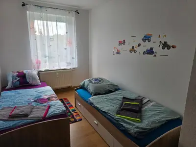 Ein Bett oder Betten in einem Zimmer der Unterkunft Ferienwohnung Wagner