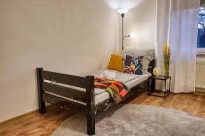 Ein Bett oder Betten in einem Zimmer der Unterkunft Krumpes Quarters