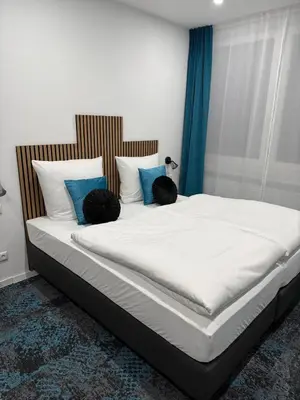 Ein Bett oder Betten in einem Zimmer der Unterkunft Das Hartmanns