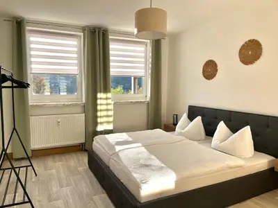 Ein Bett oder Betten in einem Zimmer der Unterkunft Ferienapartments Erzpanorama