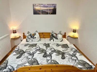 Ein Bett oder Betten in einem Zimmer der Unterkunft Ferienapartments Erzpanorama