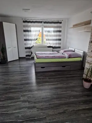 Ein Bett oder Betten in einem Zimmer der Unterkunft Ferienwohnung Krysanovsk
