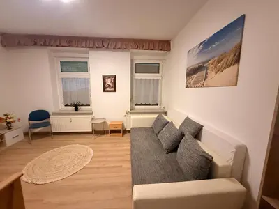 Ein Sitzbereich in der Unterkunft Ferienwohnung Goldener Drache