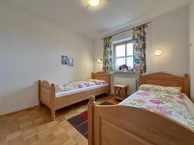 Ein Bett oder Betten in einem Zimmer der Unterkunft Blumenhof