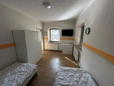 Ein Bett oder Betten in einem Zimmer der Unterkunft Exclusive Monteursunterkunft Turmgäßchen 6