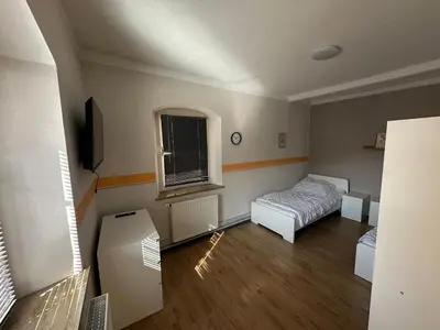 Ein Bett oder Betten in einem Zimmer der Unterkunft Exclusive Monteursunterkunft Turmgäßchen 6