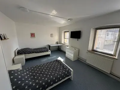 Ein Bett oder Betten in einem Zimmer der Unterkunft Exclusive Monteursunterkunft Turmgäßchen 6