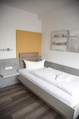 Ein Bett oder Betten in einem Zimmer der Unterkunft Landgasthof Freiberger