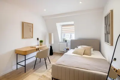 Ein Bett oder Betten in einem Zimmer der Unterkunft Business Apartment nähe Hauptbahnhof