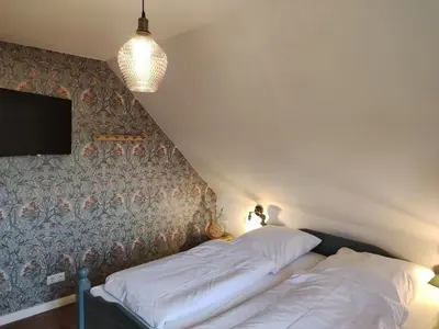 Ein Bett oder Betten in einem Zimmer der Unterkunft Holiday home in Ahorntal with swimming pool