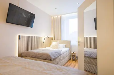 Ein Bett oder Betten in einem Zimmer der Unterkunft FlowApartment Hof, 24h Checkin, IR-Sauna, Parkplatz, WLan250Mbit