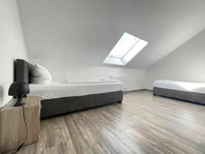 Ein Bett oder Betten in einem Zimmer der Unterkunft STB113 geräumige Monteurwohnung