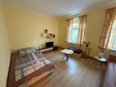 Ein Bett oder Betten in einem Zimmer der Unterkunft Ferienwohnung Goldener Drache