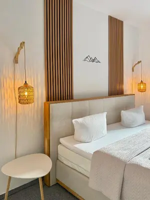 Ein Bett oder Betten in einem Zimmer der Unterkunft Apart 1244 Bergblick