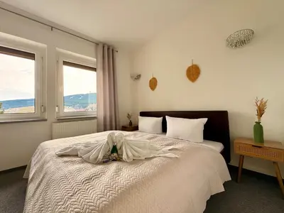 Ein Bett oder Betten in einem Zimmer der Unterkunft Apart 1244 Bergblick