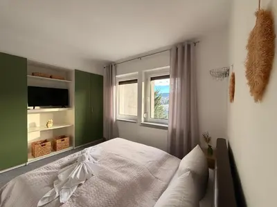 Ein Bett oder Betten in einem Zimmer der Unterkunft Apart 1244 Bergblick