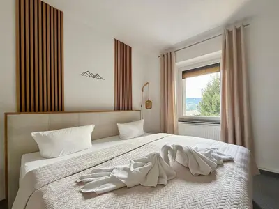 Ein Bett oder Betten in einem Zimmer der Unterkunft Apart 1244 Bergblick