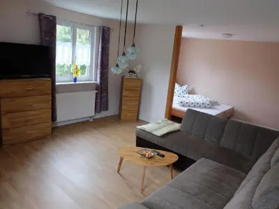 Ein Sitzbereich in der Unterkunft Holiday Home am Wald mit Sauna by Interhome