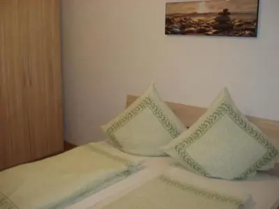 Ein Bett oder Betten in einem Zimmer der Unterkunft Apartment Haus Steinwaldblick by Interhome