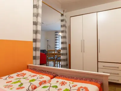 Ein Bett oder Betten in einem Zimmer der Unterkunft Apartment mit Balkon und Geschirrspülmaschine by Interhome