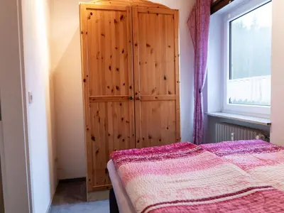 Ein Bett oder Betten in einem Zimmer der Unterkunft Apartment Tolles Appartement mit offenem Kamin by Interhome