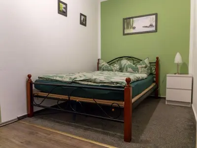 Ein Bett oder Betten in einem Zimmer der Unterkunft Apartment mit zwei Schlafzimmern und Balkon by Interhome